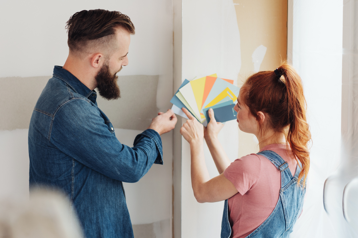Couple looking at paint swatches